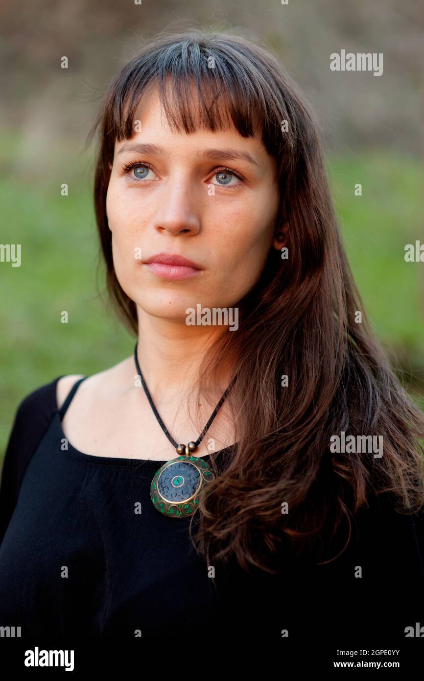 Beautiful woman with blue eyes in the park Stock Photo Alamy