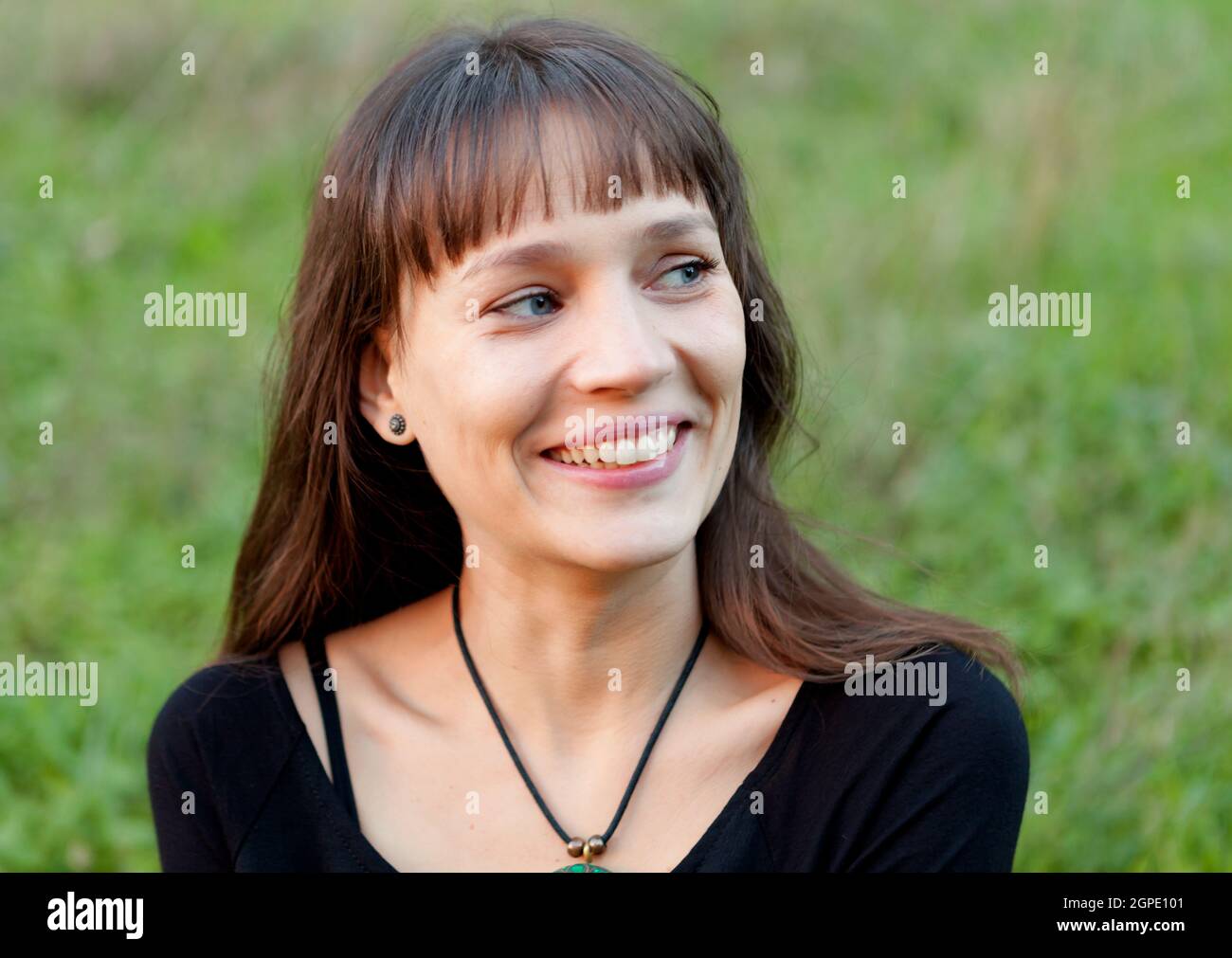 Beautiful woman with blue eyes in the park Stock Photo Alamy