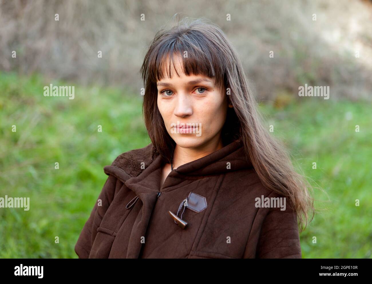 Beautiful woman with blue eyes in the park Stock Photo Alamy