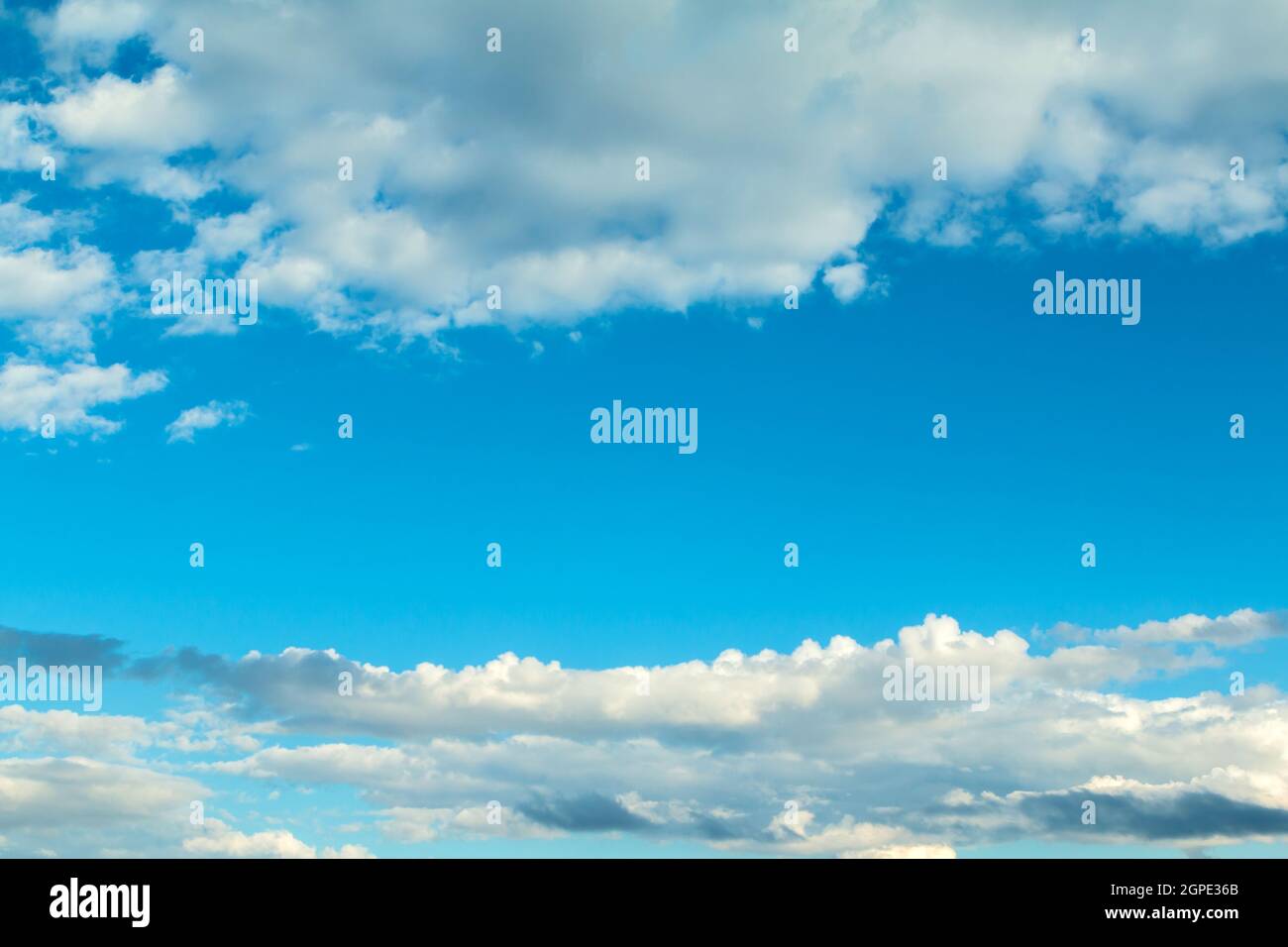 Fluffy clouds decorating a beautirful blue sky Stock Photo
