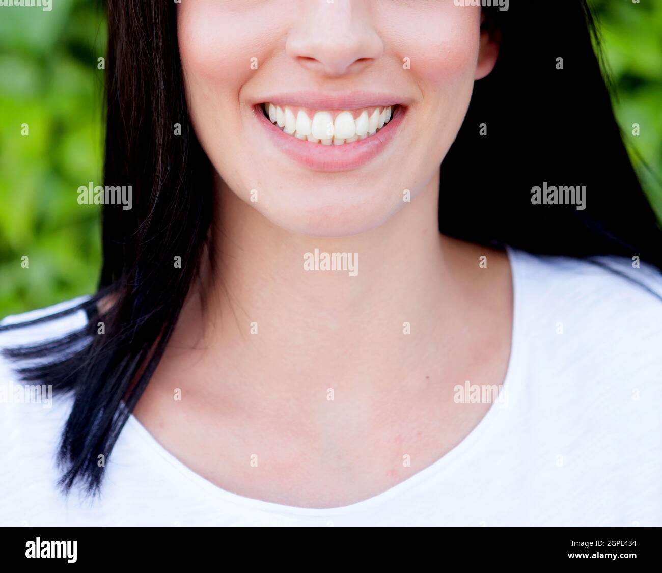Brunette woman showing her perfect teeth Stock Photo