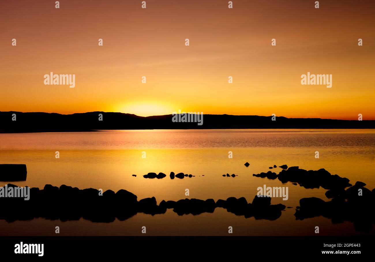 Amazing sunset with golden and black colours Stock Photo - Alamy