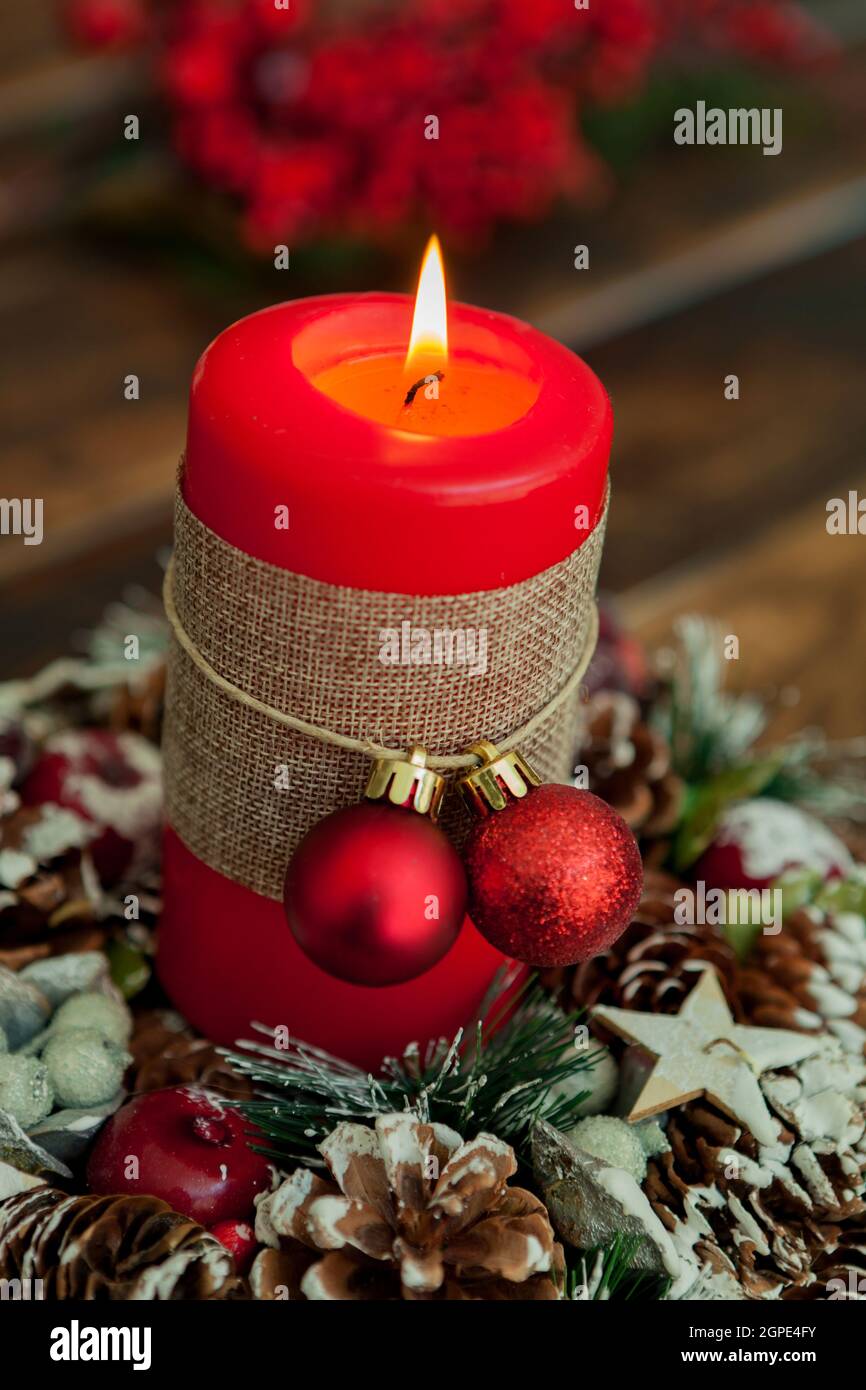 Candle for Christmas in red. Beautiful Holidays decoration Stock Photo