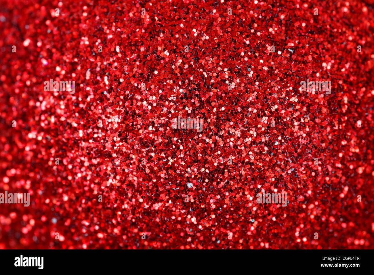 Red Christmas ball close-up. Shiny texture for wallpaper Stock Photo