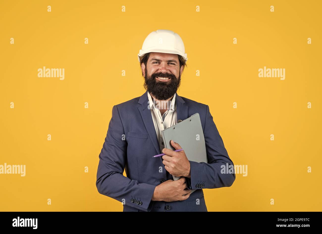 architecture and building. male builder wearing formal suit and helmet ...