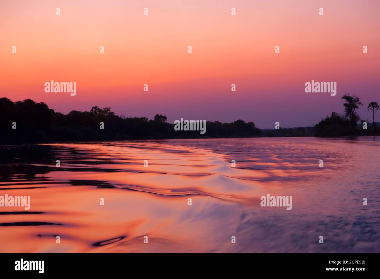 Sunset over the Kunene River (Cunene River), the border between Angola and Namibia, south-west Africa Stock Photo