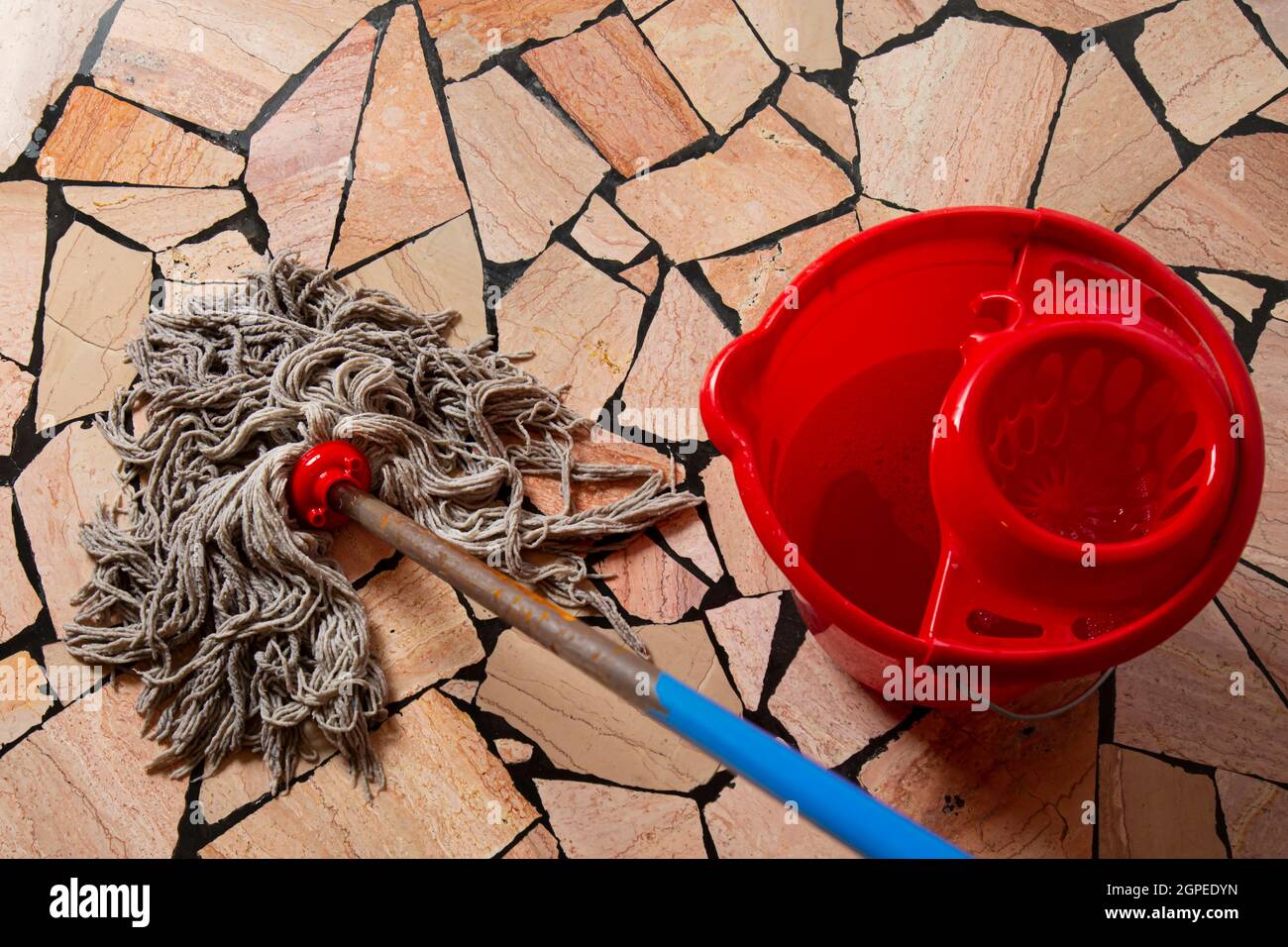 https://c8.alamy.com/comp/2GPEDYN/house-cleaning-concept-cleaning-floors-in-the-house-red-bucket-and-mop-2GPEDYN.jpg