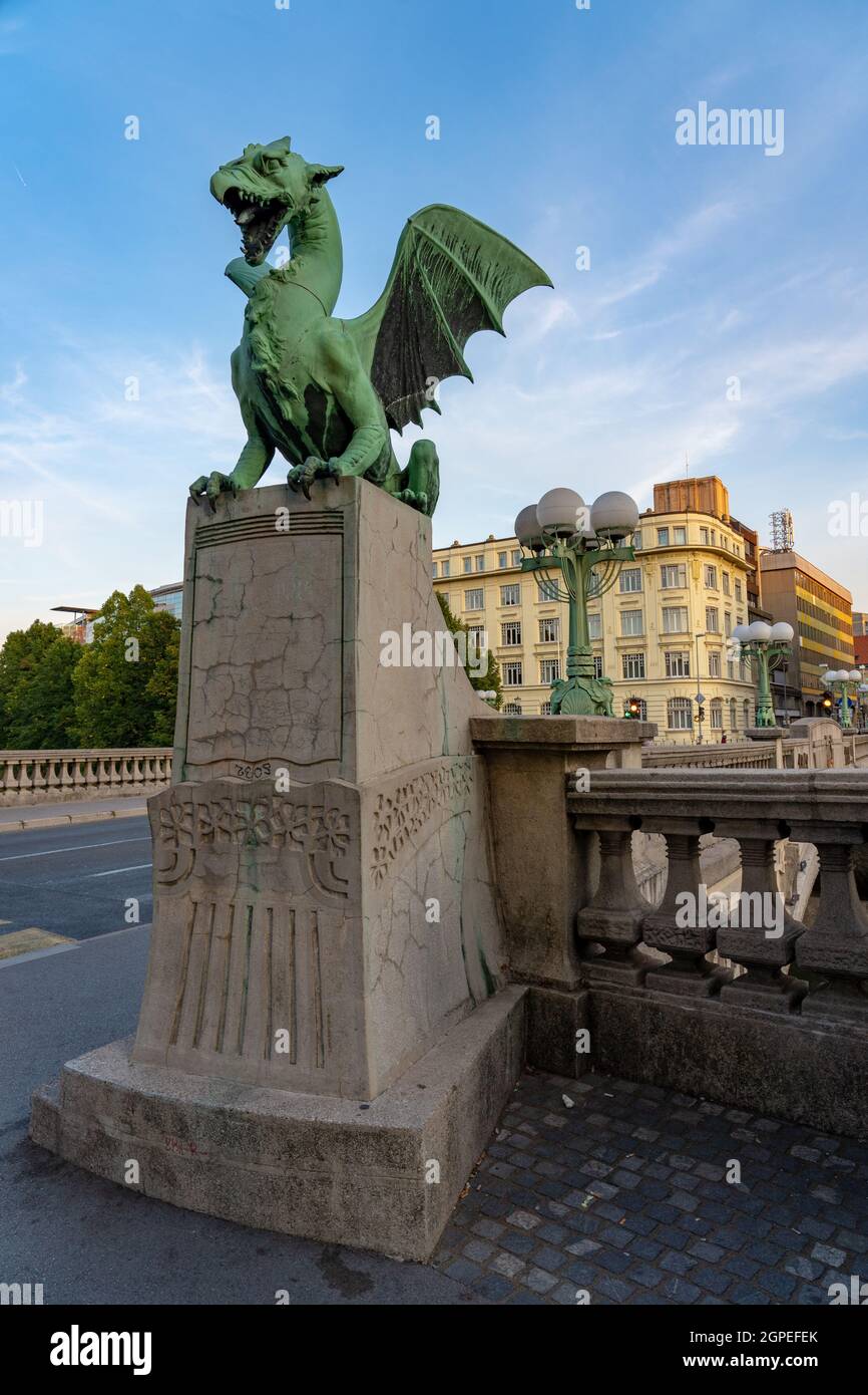 Dragon bridge in Ljubljana with dragon statue . Stock Photo