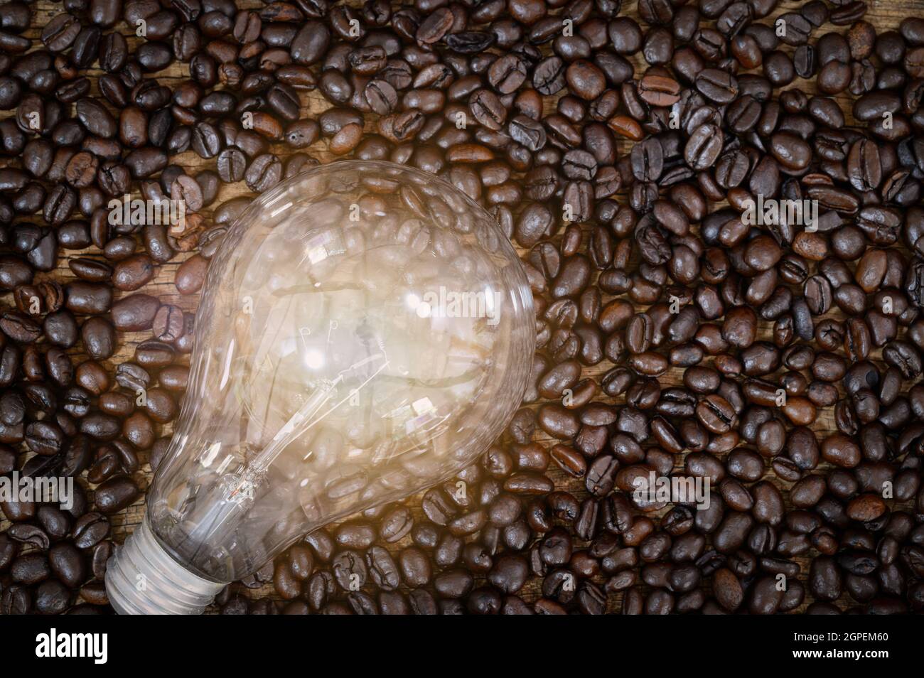 light bulb shining on a coffee bean Stock Photo Alamy
