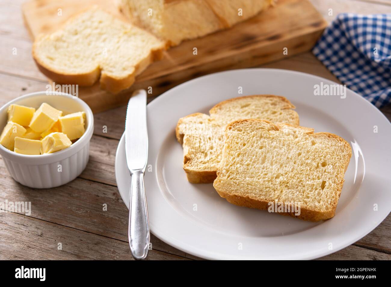Braided egg bread on wooden table Stock Photo