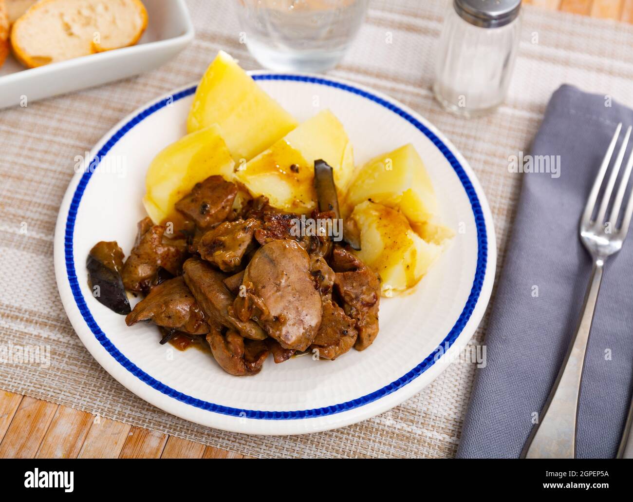 Fried rabbit liver served with boiled potato Stock Photo