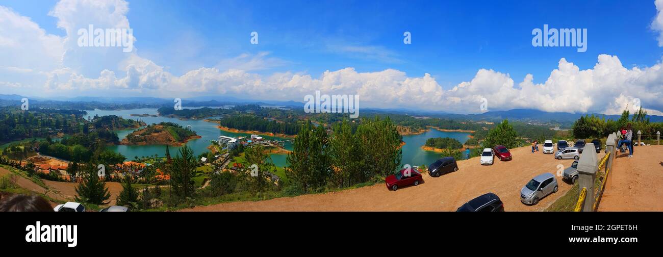 Panoramic shot of Guatape under a blue cloudy sky Stock Photo