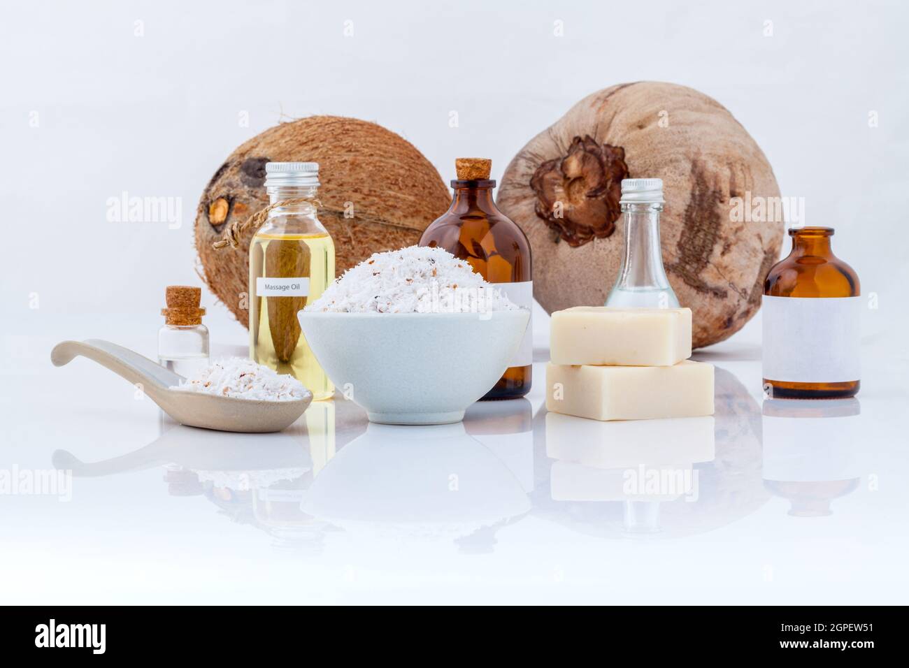 Coconut essential Oils natural Spa Ingredients for scrub ,massage and skin care isolate on white background. Stock Photo