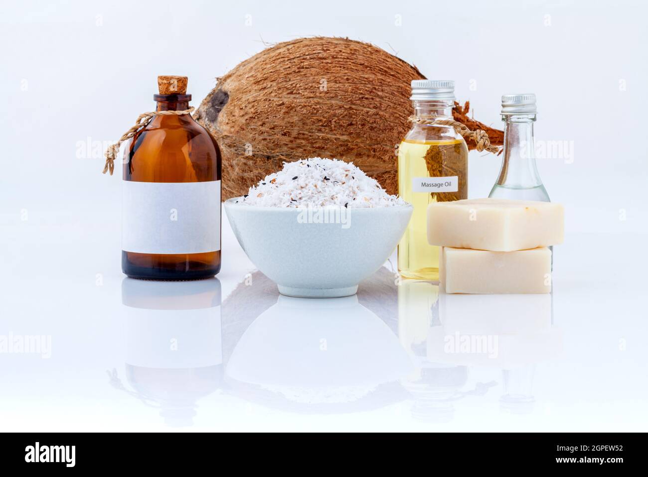 Coconut essential Oils natural Spa Ingredients for scrub ,massage and skin care isolate on white background. Stock Photo
