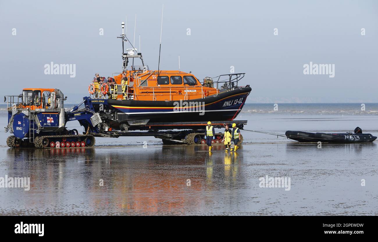 England, Kent, Dungeness, RNLI land crew bringing in the lifeboat. Stock Photo