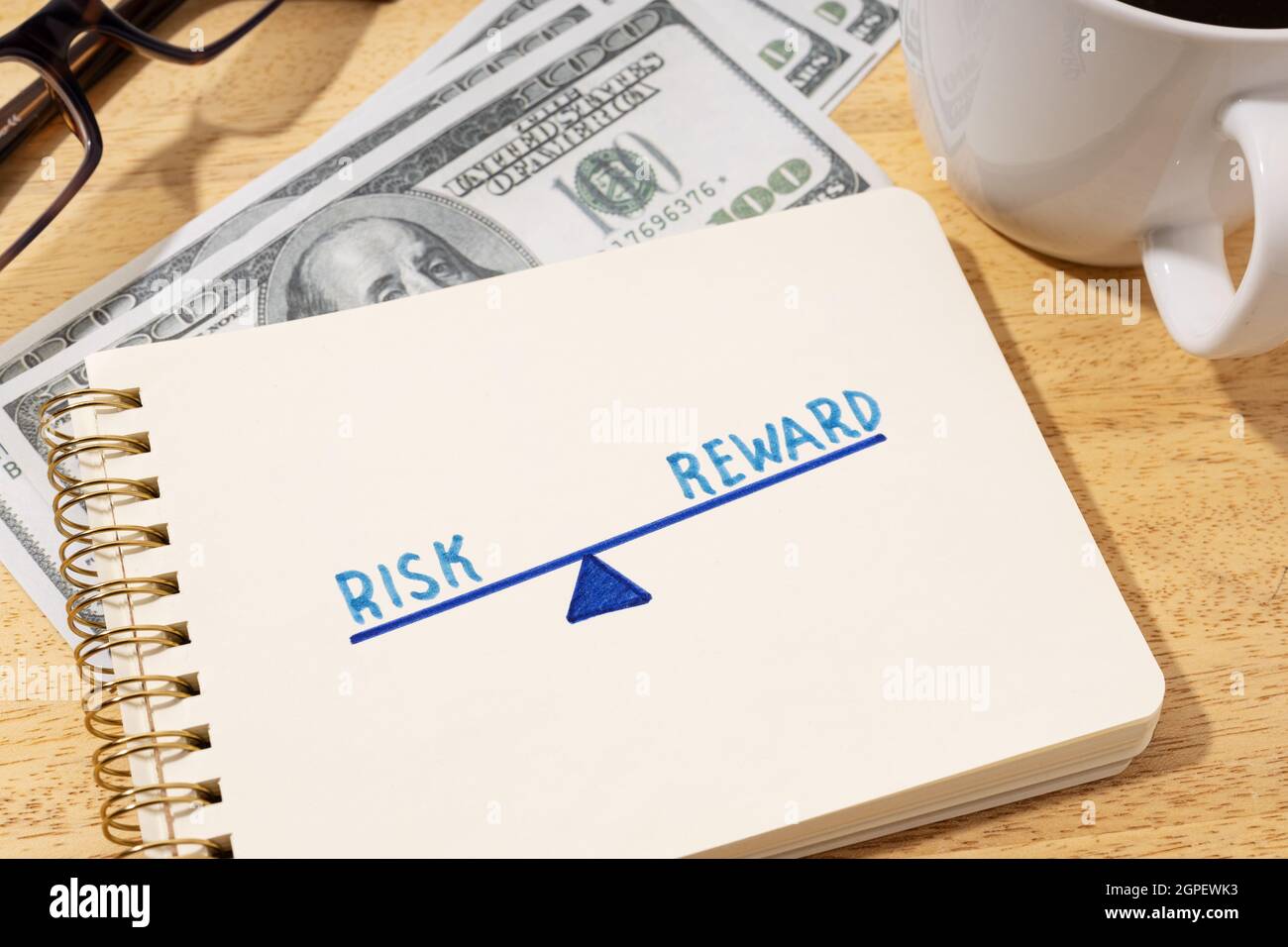 Risk reward concept. Drawing on notepad on desk Stock Photo