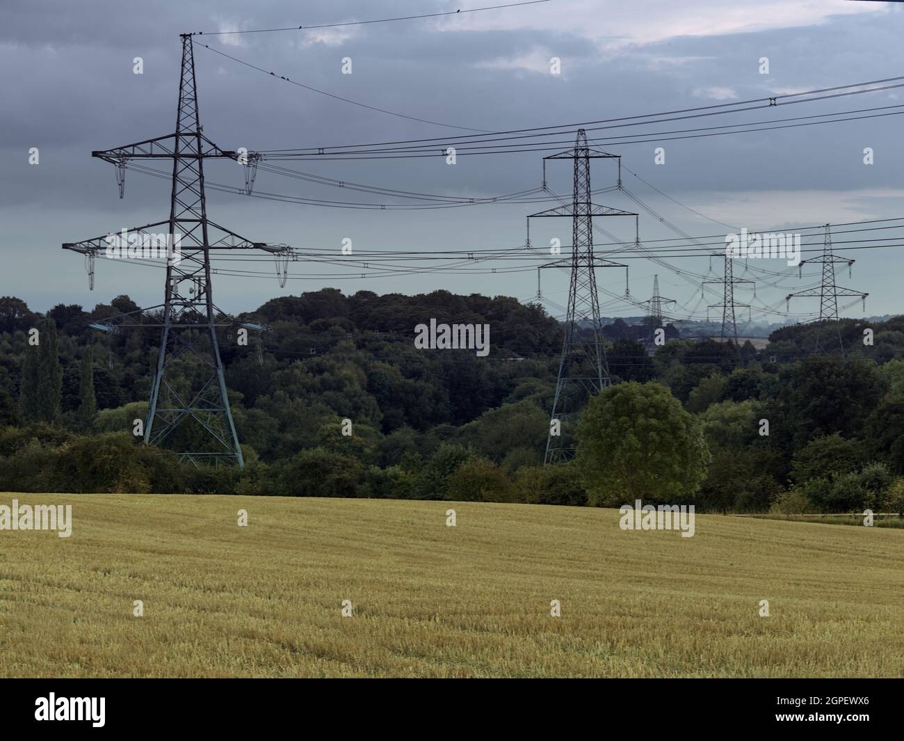 Pylons carrying high voltage(HV) electricity across the North East Derbyshire landscape. Stock Photo