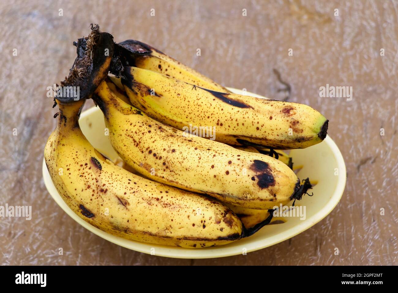 Ripe yellow bananas fruits, bunch of ripe bananas with dark spots Stock Photo