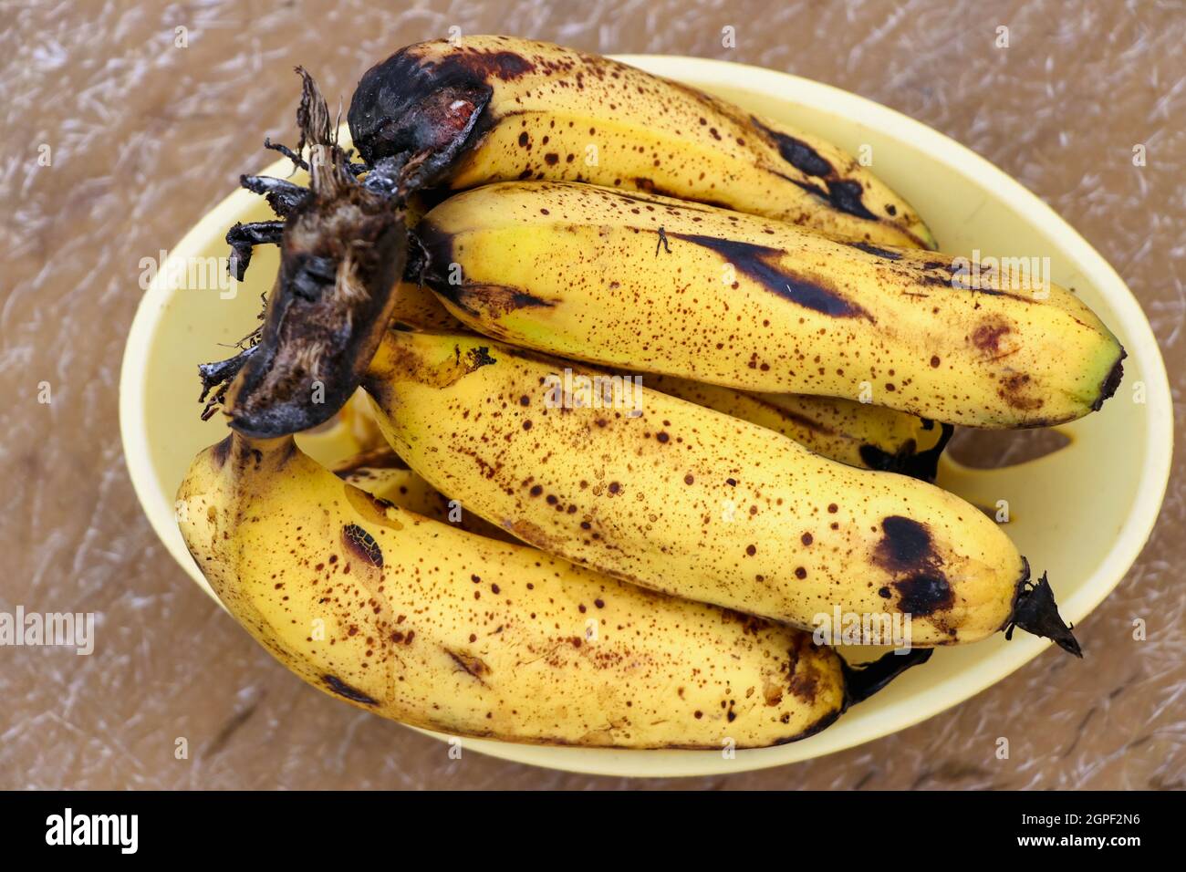 Ripe yellow bananas fruits, bunch of ripe bananas with dark spots Stock Photo