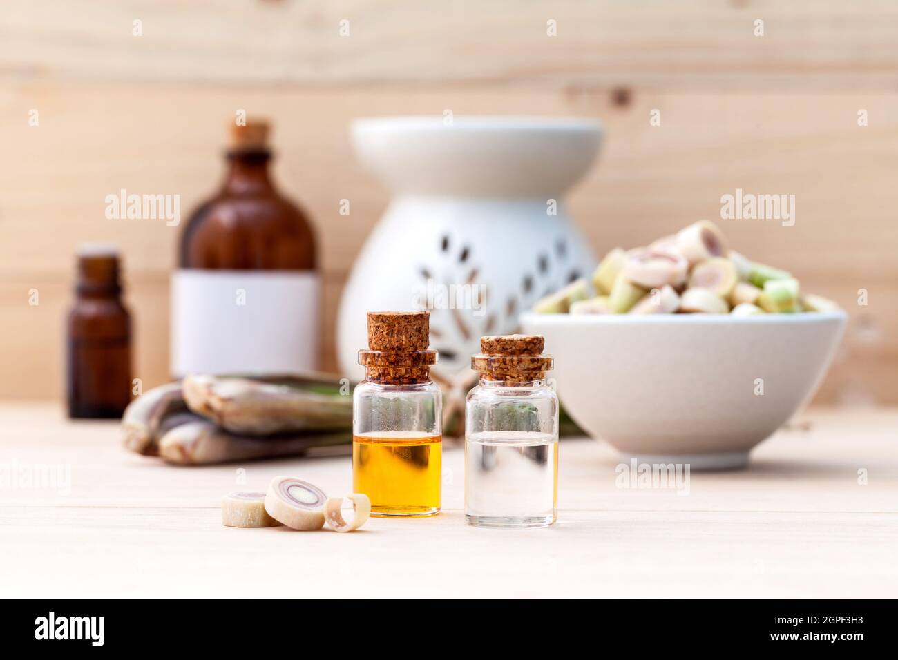 Natural Spa Ingredients Lemongrass essential Oil  with Aromatherapy Burners on wooden background. Stock Photo