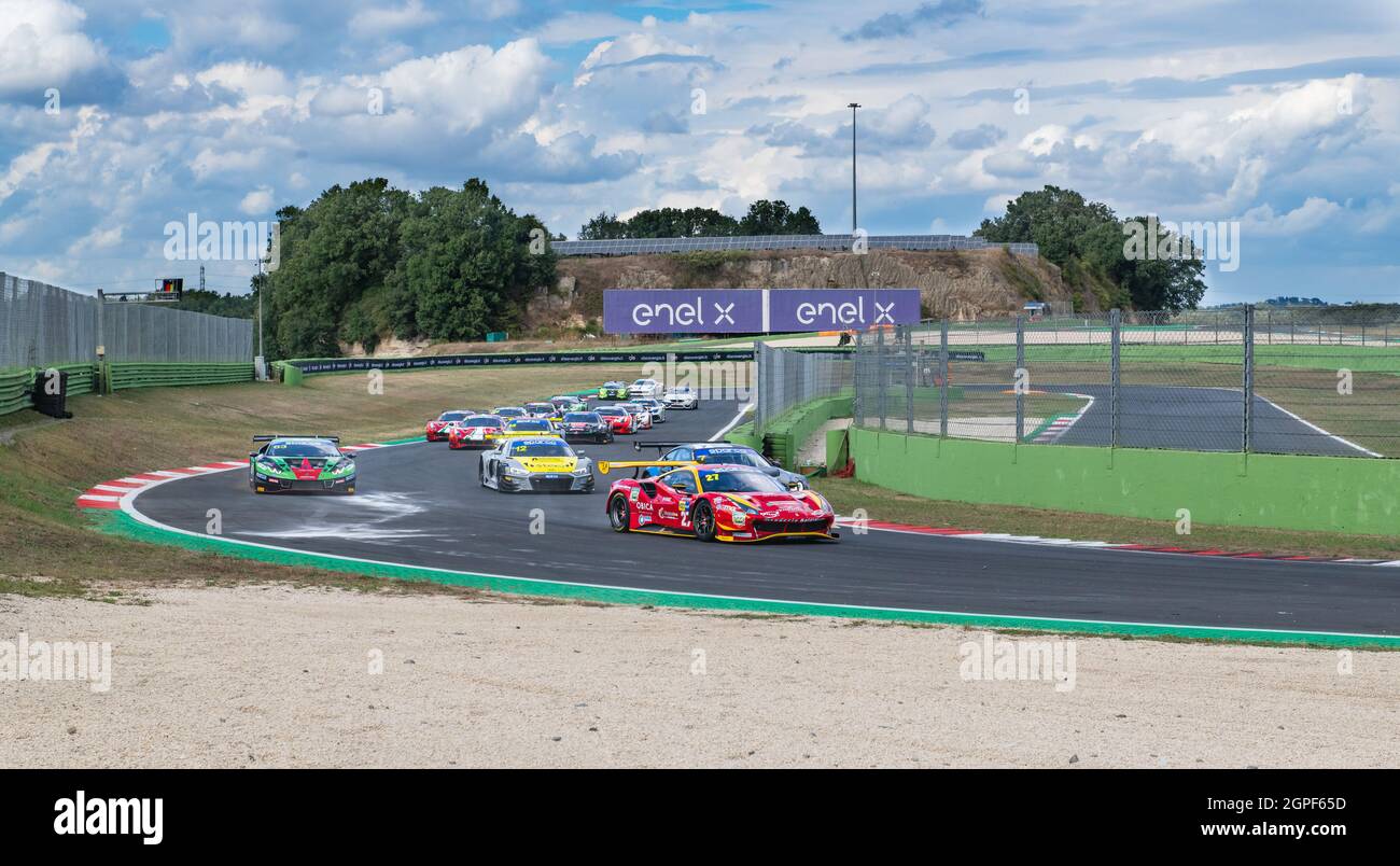 Vallelunga, italy september 19th 2021 Aci racing weekend. Large view of race touring cars group of various brand on asphalt track against blue sky Stock Photo