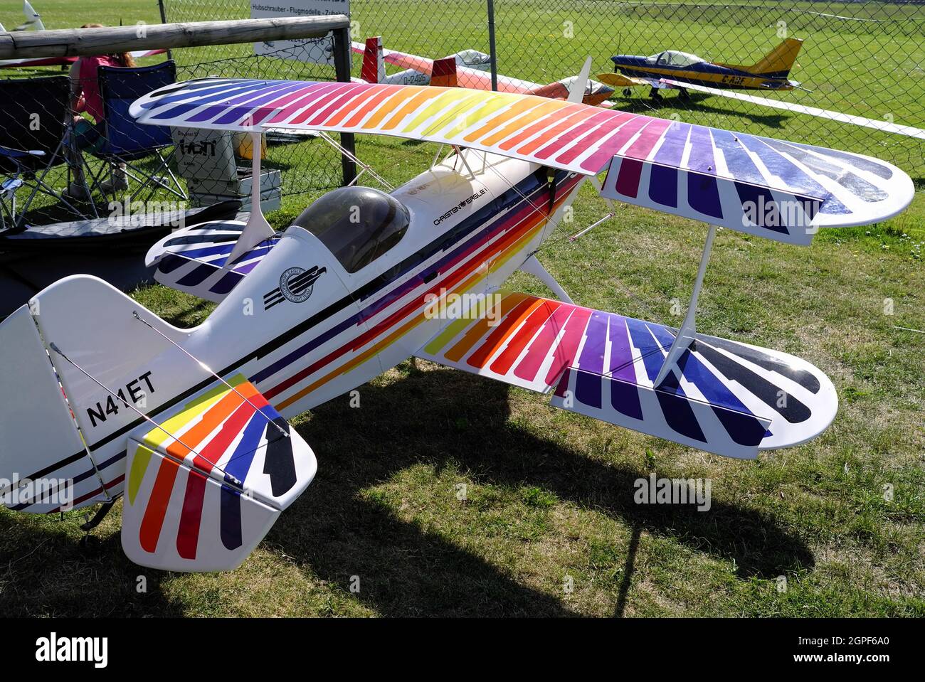 Remote controlled colorful biplane aerobatic model Christen Eagle with propeller on the ground in Germany, Europe Stock Photo