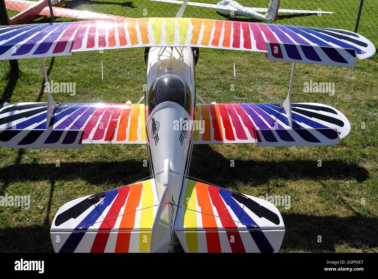 Remote controlled colorful biplane aerobatic model Christen Eagle with propeller on the ground in Germany, Europe Stock Photo