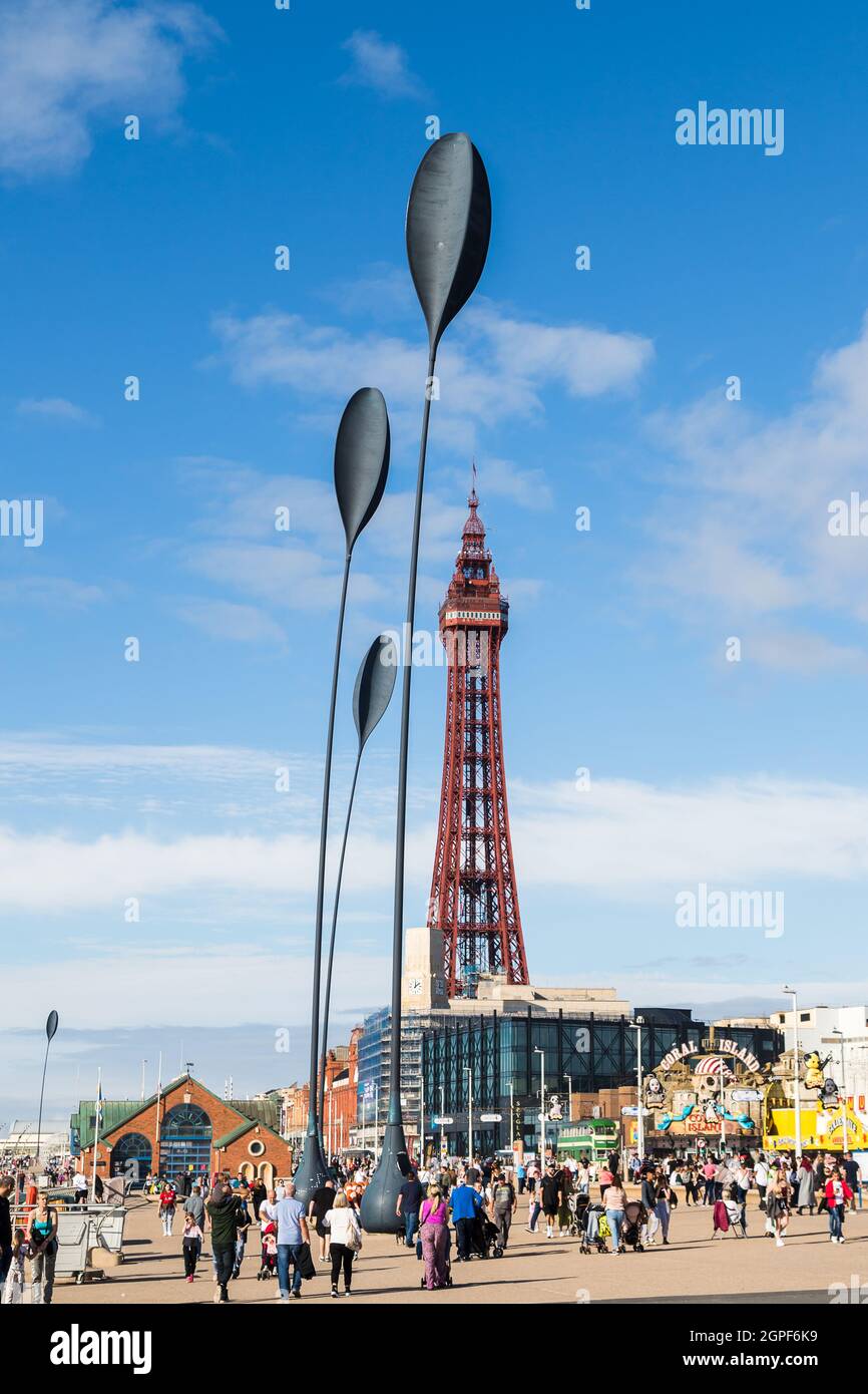 Tourists seen under the four giant spoon sculptures, Blackpool Tower