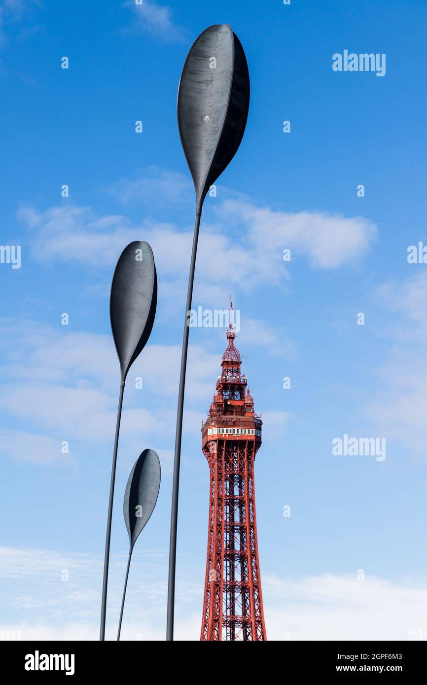 Dart sculptures seen in front of Blackpool Tower under a blue sky in  September 2021. The four tall sculptures bend and wave with the wind on the  Blac Stock Photo - Alamy