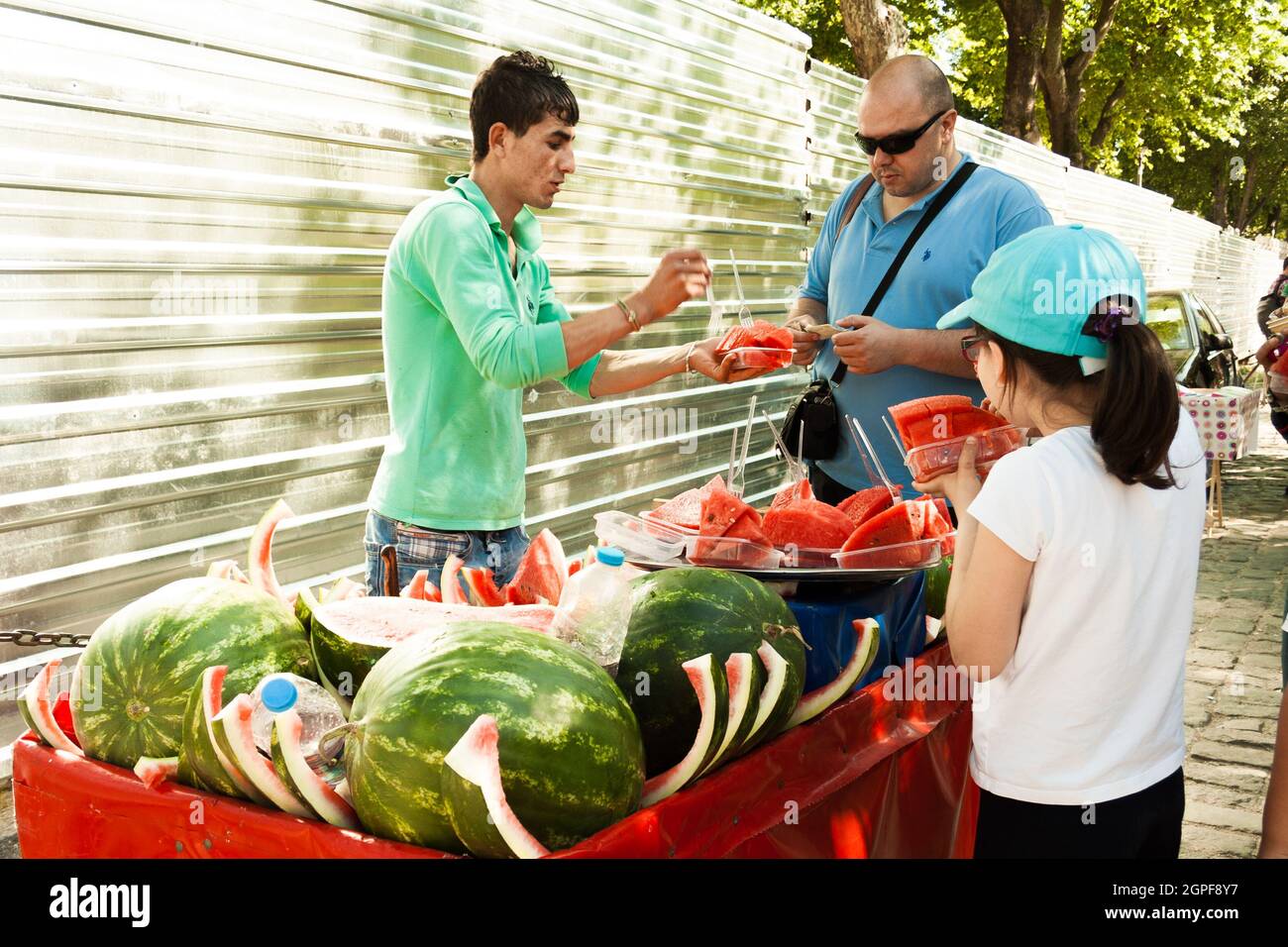 ISTANBUL,TURKEY-JUNE 7:Guys slicing watermelon to sell at their