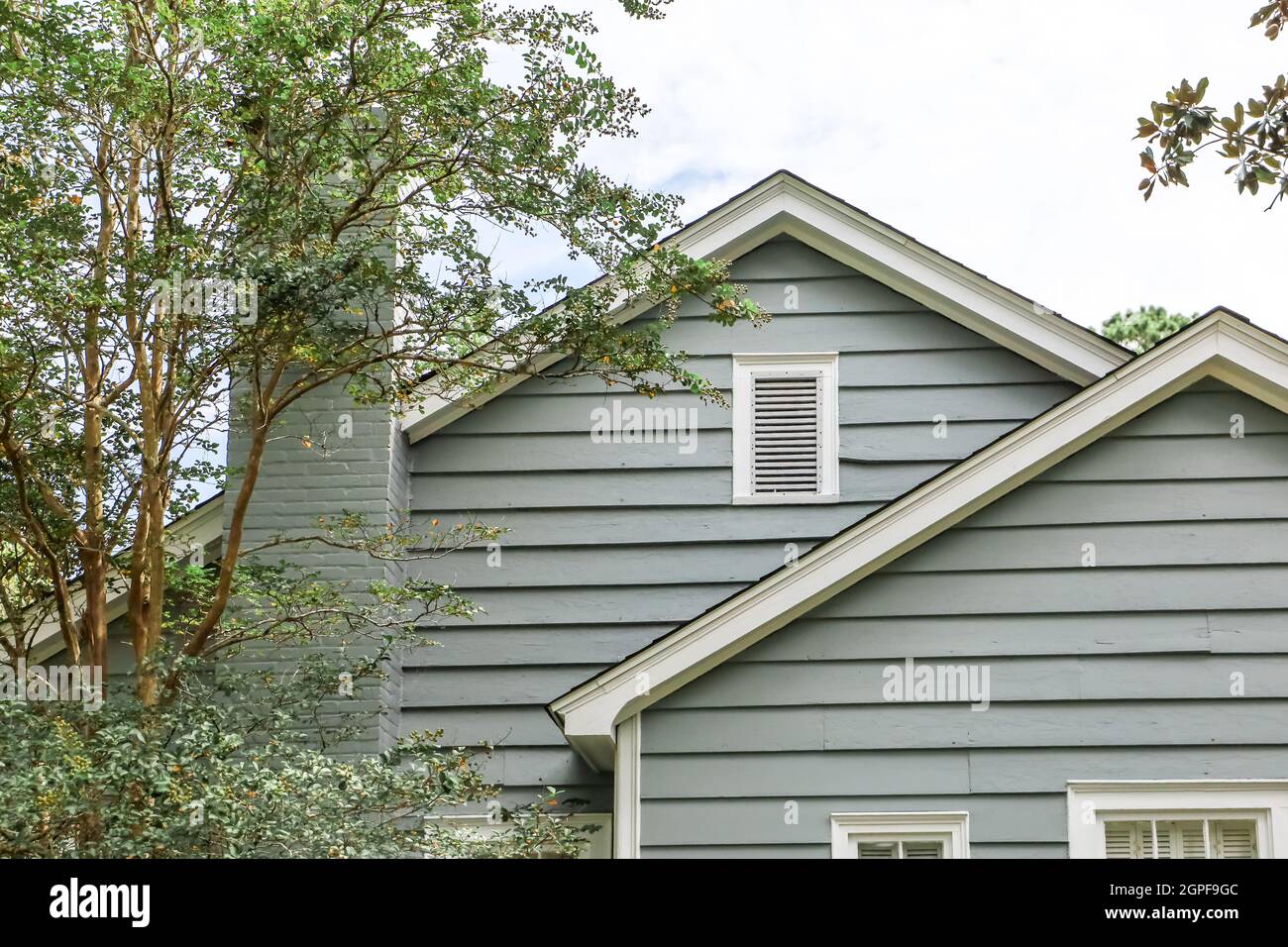 The side view of a blue small cottage style house Stock Photo Alamy