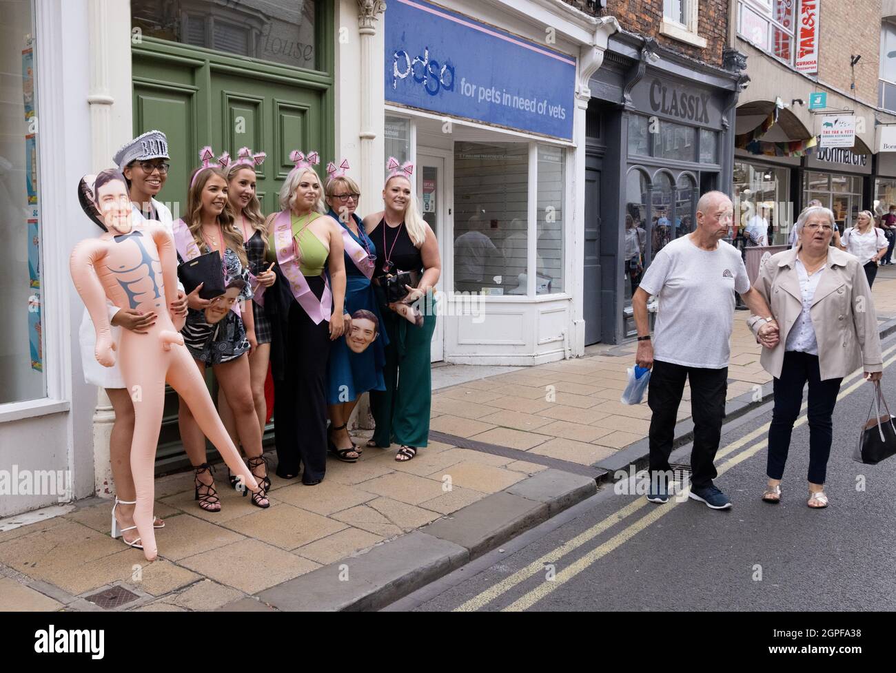 Hen party UK; a hen party having photos on The street, opportunity for street photography, York UK Stock Photo