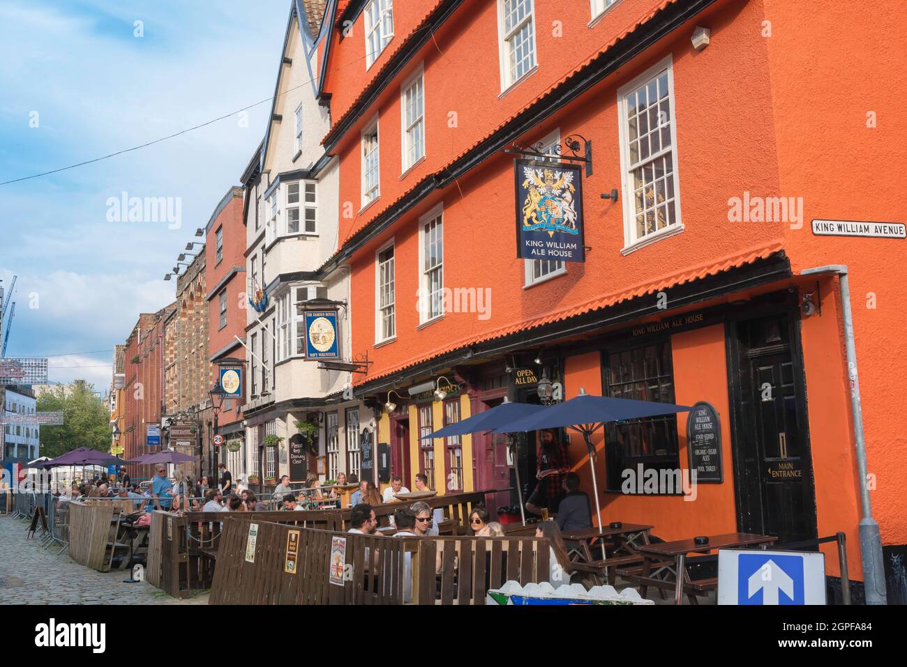 Bristol pub, view of people relaxing at tables outside popular pubs in