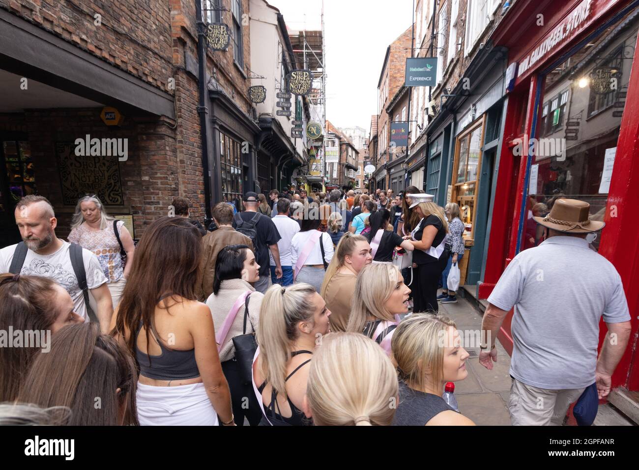 The Shambles, York UK; a medieval street crowded with a crowd of tourists, York city centre, York UK Stock Photo