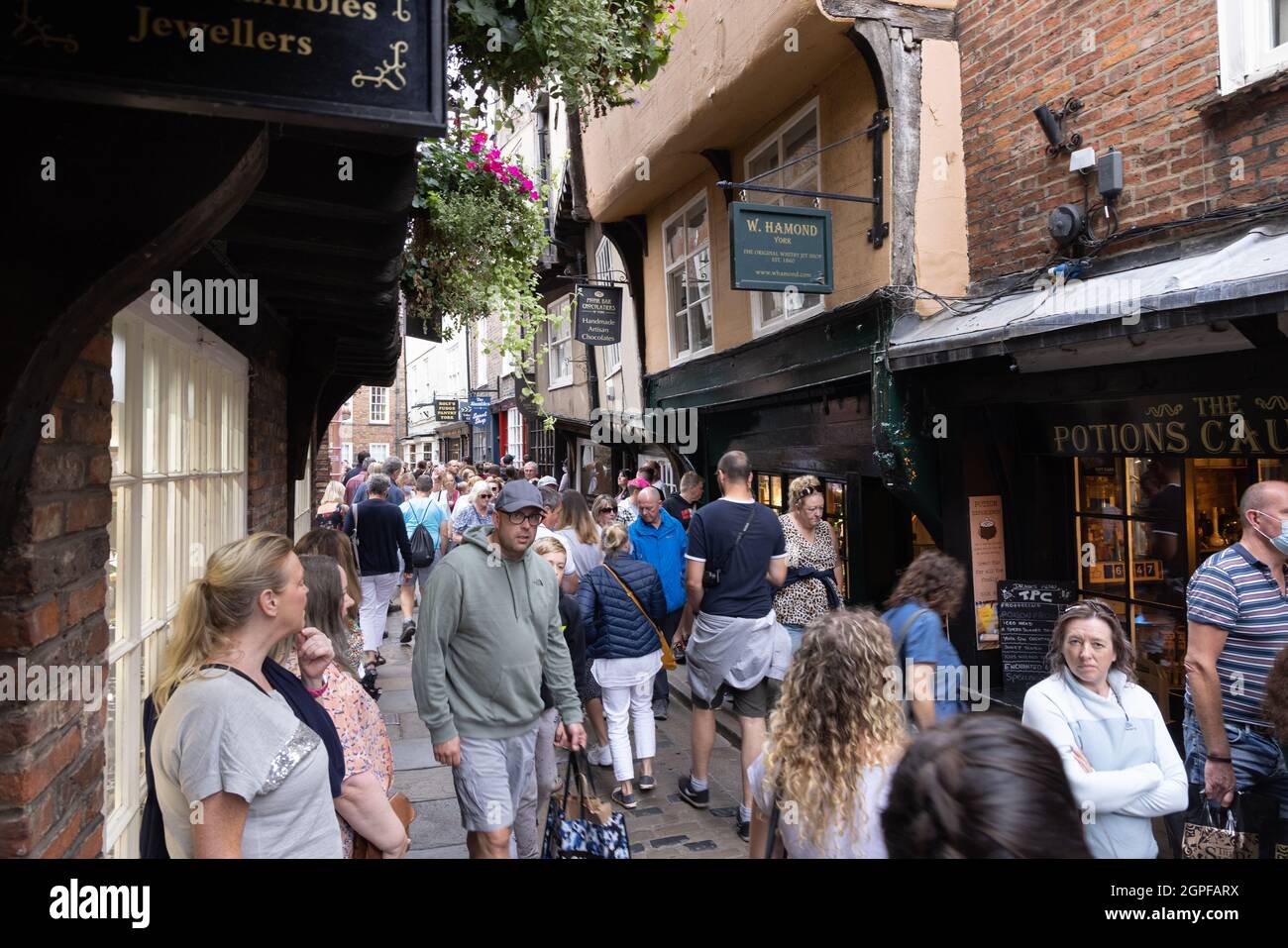 The Shambles, York UK; a medieval street crowded with a crowd of tourists, York city centre, York UK Stock Photo