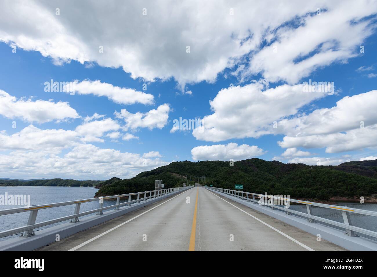 landscape of beautiful blue sky over bridge with white clouds, Imdong dam reservoir, Korea Stock Photo