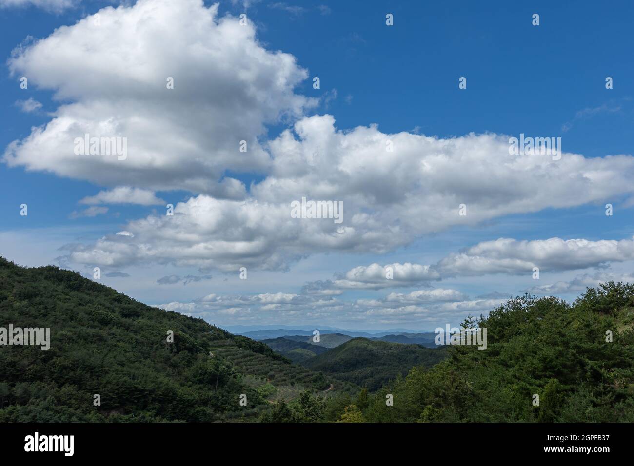 landscape of beautiful blue sky over mountain with white clouds, Korea Stock Photo