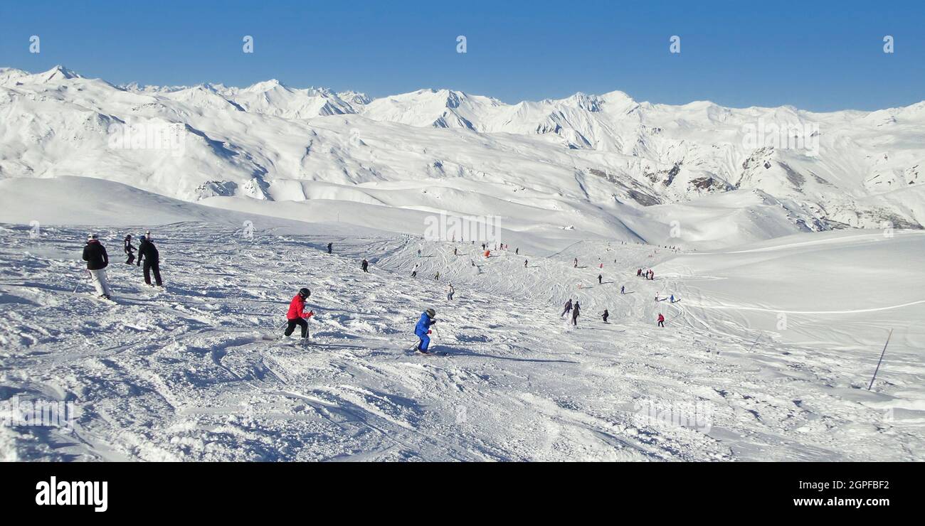 Panorama of skiers on a ski slope, the Alps, France. Winter sports web banner Stock Photo