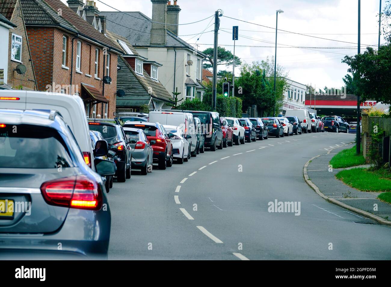 Queue of cars at a petrol station due to panic buying in south england Stock Photo