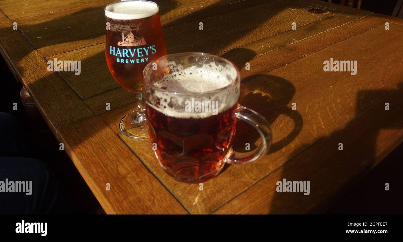 September sunshine beams across this pub table with a pint & a half of Harvey's beer brewed in