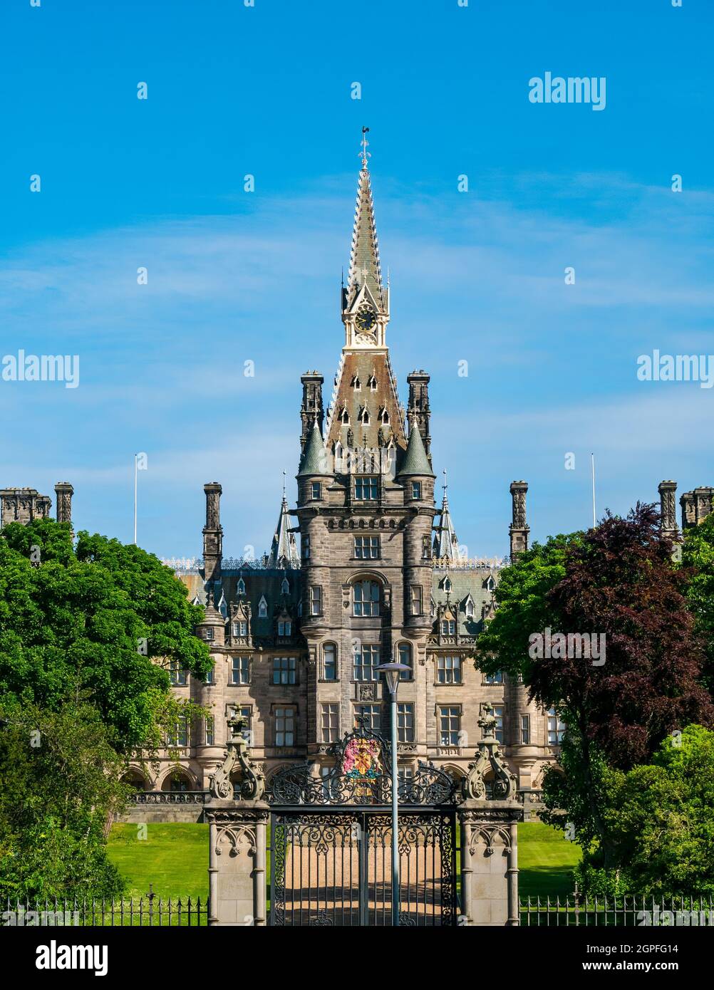 Scots baronial style Fettes College independent school building by David Bryce on sunny day with ornate wrought iron gate, Edinburgh, Scotland, UK Stock Photo