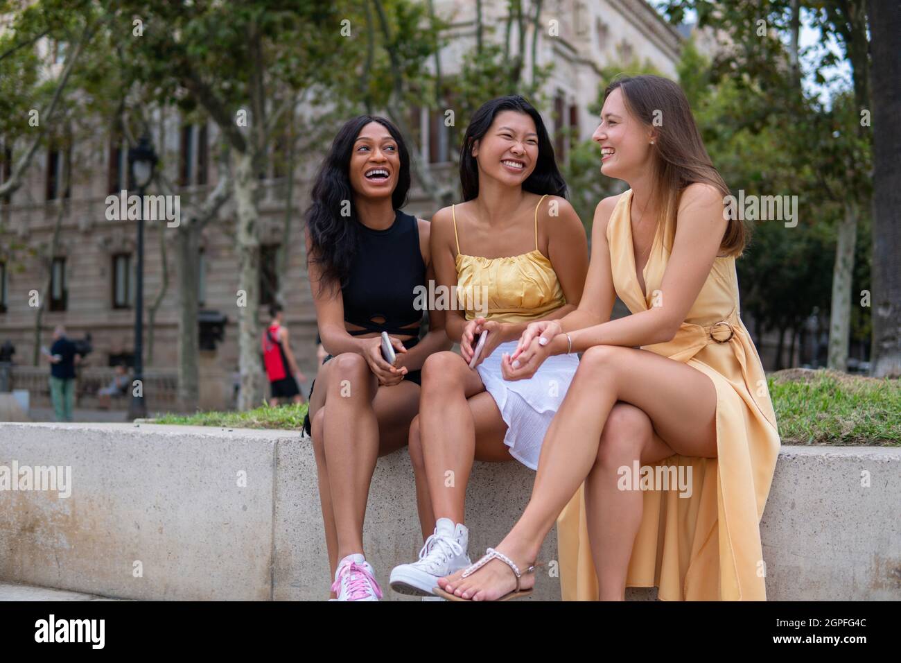 Young diverse friends joyfully meeting hi-res stock photography and ...