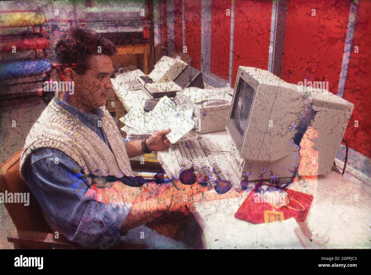 Austin Texas USA, 1995: Hispanic male high school teacher entering grades into the computer. MR EC-0056  ©Bob Daemmrich Stock Photo