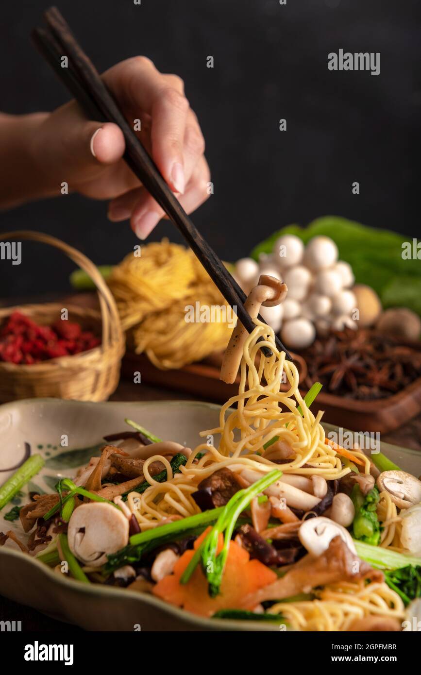 Stir-fried noodles with mushrooms and beef, a very good dish Stock Photo