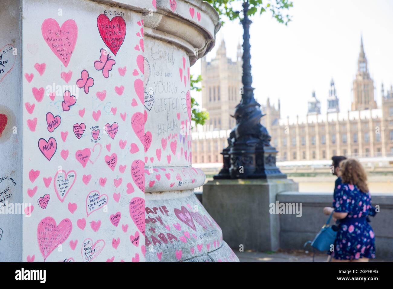 The National Covid Memorial Wall is seen along the River Thames opposite the Houses of Parliament in central London. Stock Photo