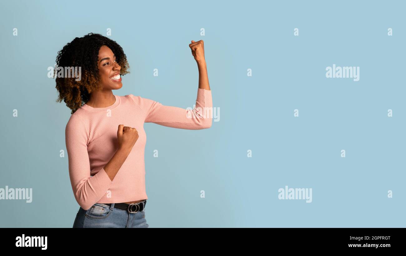African american person raising hands hi-res stock photography and ...