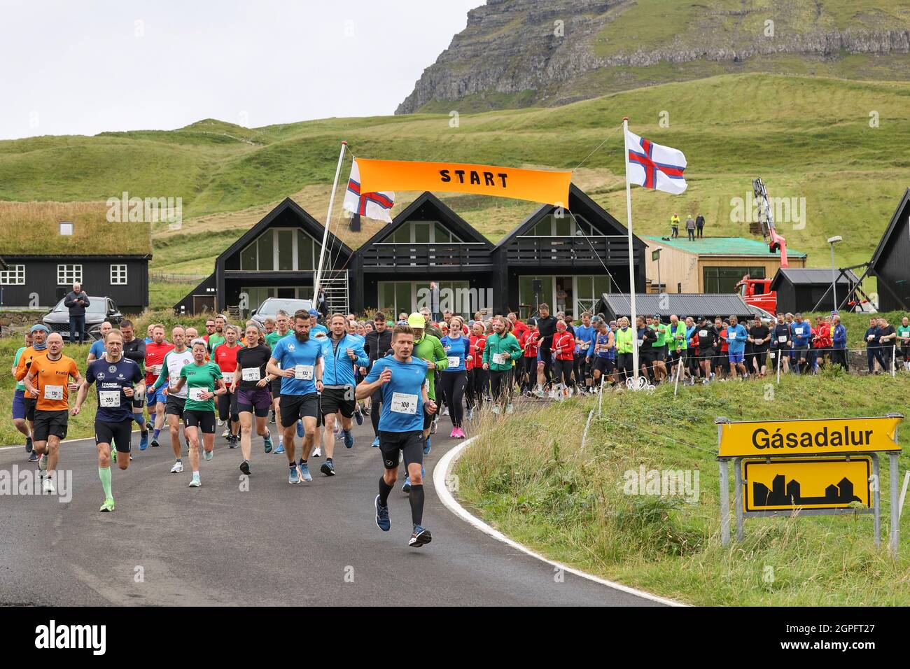 Runners starting in the half marathon from Gasadalur to Sandav‡gur, Vagar  Island, Faroe Islands.Europe Stock Photo - Alamy