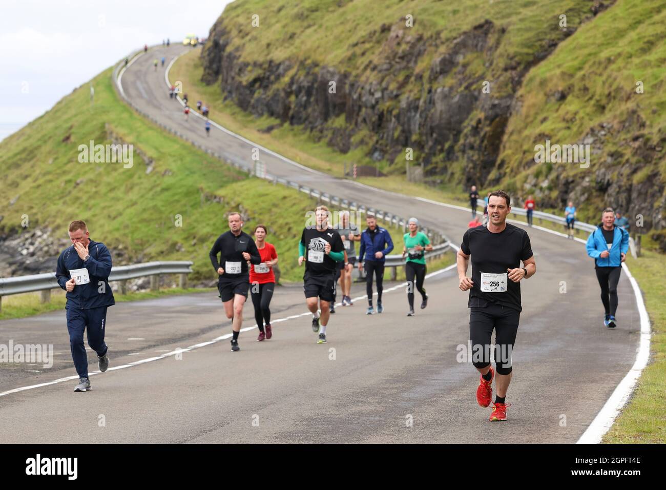 Runners participating in the half marathon from Gasadalur to Sandav‡gur, Vagar Island, Faroe Islands,Europe, Stock Photo