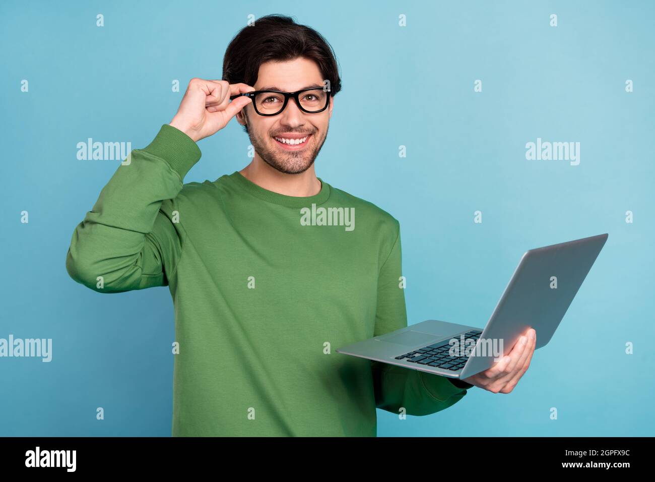 Smiling Computer Nerd Photo of young smart smiling businessman geek nerd working in laptop ...