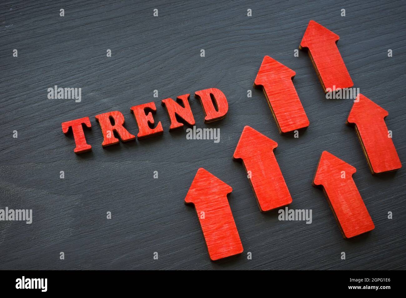 Modern trend word and red rising arrows. Stock Photo